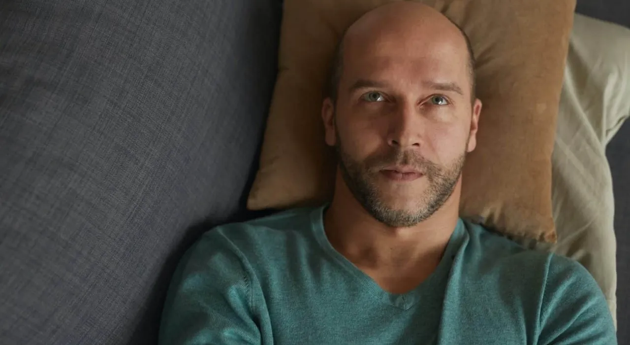 man laying down envisioning the future of his business